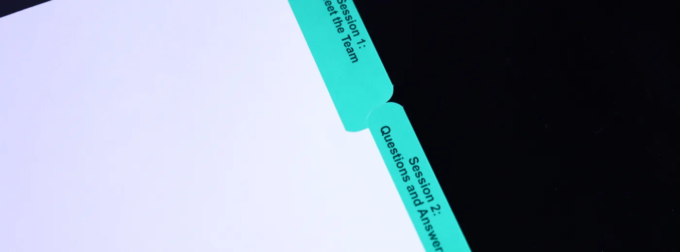 Green Mylar index tabs printed with client-facing section titles — custom printed tab dividers by Anselmo Die & Index